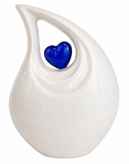 Ivory Heart teardrop urn displayed on a table