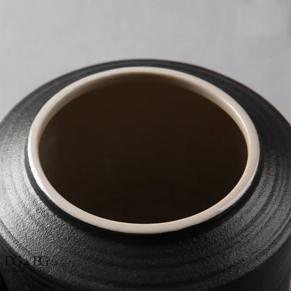 Tight Seal Keepsake Urn in ceramic finish, minimalist design, size and scale reference