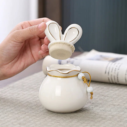 Rabbit Pet Urn in ceramic finish, whole-pet design, lid and closure detail